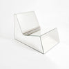 Discover a modern chair with a minimalist design, featuring a reflective mirror surface. Its angular shape creates a geometric aesthetic, set against a plain white background. This stunning piece of furniture is available for sale by The Graduate Gallery.