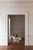 Discover a modern chair with a minimalist design, featuring a reflective mirror surface. Its angular shape creates a geometric aesthetic, set against a plain white background. This stunning piece of furniture is available for sale by The Graduate Gallery.