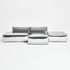 A modern, metallic couch from Project 213A a European design house launched in 2021, boasts a shiny silver finish and angular design.