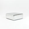 A modern, metallic couch from Project 213A a European design house launched in 2021, boasts a shiny silver finish and angular design.