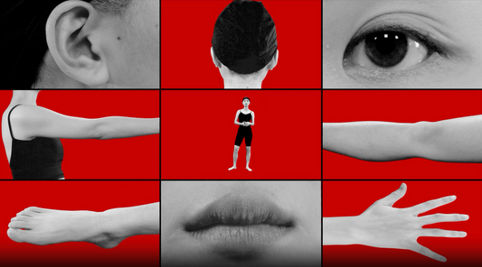 A video collage by a graduate artist in the UK features a central image of a person standing amid close-up shots of body parts: ear, back of the head, eye, three arms in varying poses, lips, and a hand. The bold red background enhances this intriguing visual narrative.