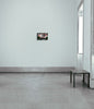 A heavily pixelated eye overlays a black-and-white image of two people on a bench. Green trees frame the scene, hinting at the creative talent of a graduate artist in the UK. At the bottom, a Send message icon invites you to explore more graduate artworks for sale by The Graduate Gallery