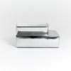 A modern, metallic couch from Project 213A a European design house launched in 2021, boasts a shiny silver finish and angular design. With its rectangular backrest, this piece of furniture stands elegantly against a plain white background.