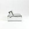 A modern, metallic couch from Project 213A a European design house launched in 2021, boasts a shiny silver finish and angular design. 