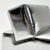 A modern, metallic couch from Project 213A a European design house launched in 2021, boasts a shiny silver finish and angular design. 