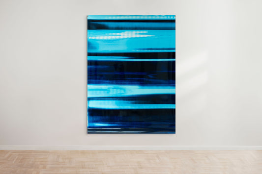 An abstract artwork by a graduate artist in the UK features horizontal bands of blue. The colors blend and blur, creating a dynamic, textured effect. Displayed with small metal clips at the corners, this piece is part of the graduate artworks for sale by The Graduate Gallery.